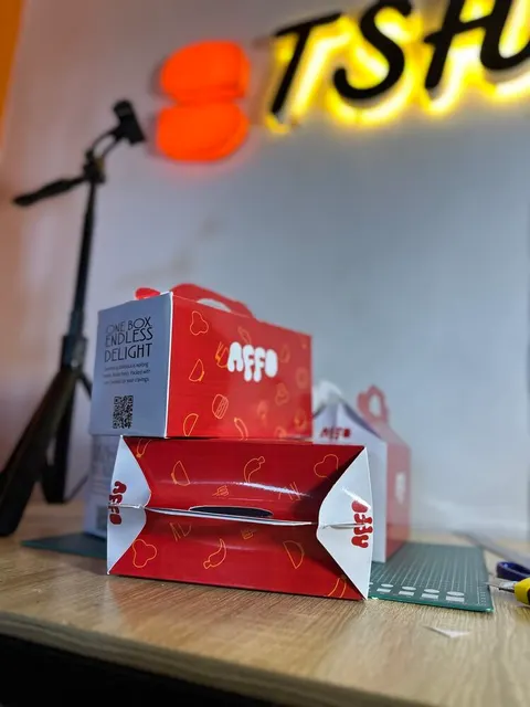 AFFO branded food carton with a carry handle